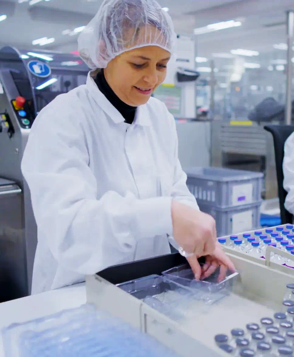 A scientist operating lab equipment